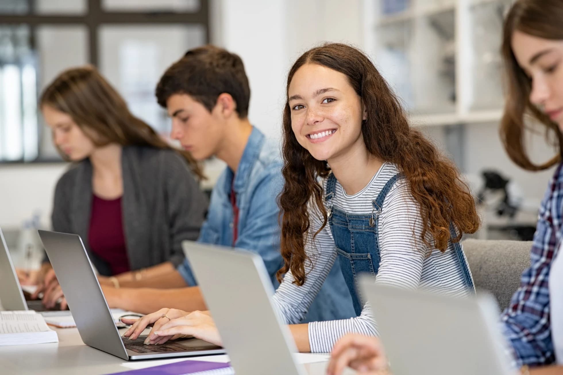 Students using laptops in class